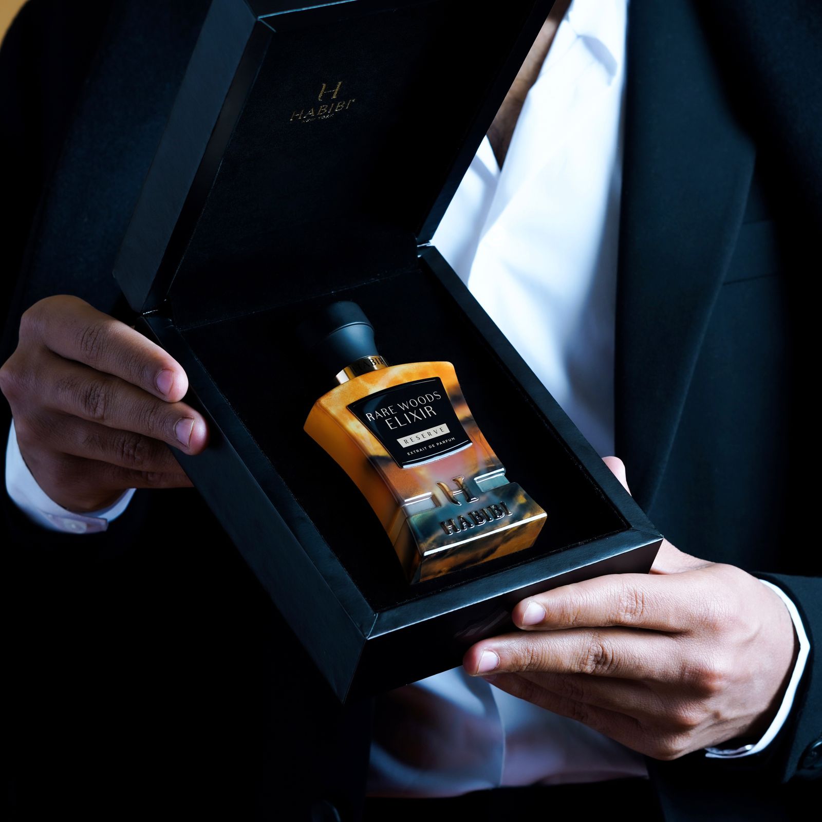 Rare Woods Elixer fragrance in a black box