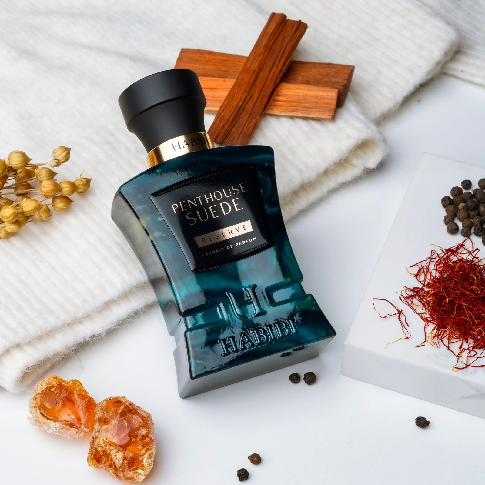 Penthouse Suede  A luxurious perfume in a blue bottle, by habibi new york