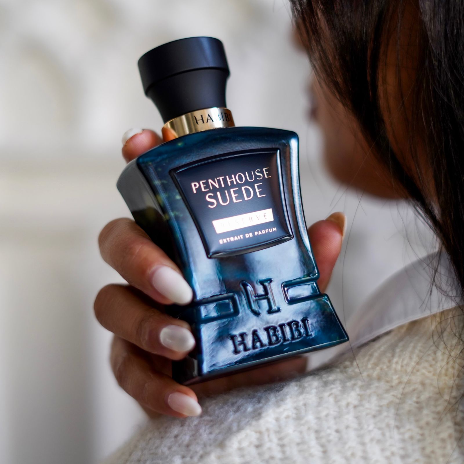 Penthouse Suede : A luxurious fragrance in a blue bottle
