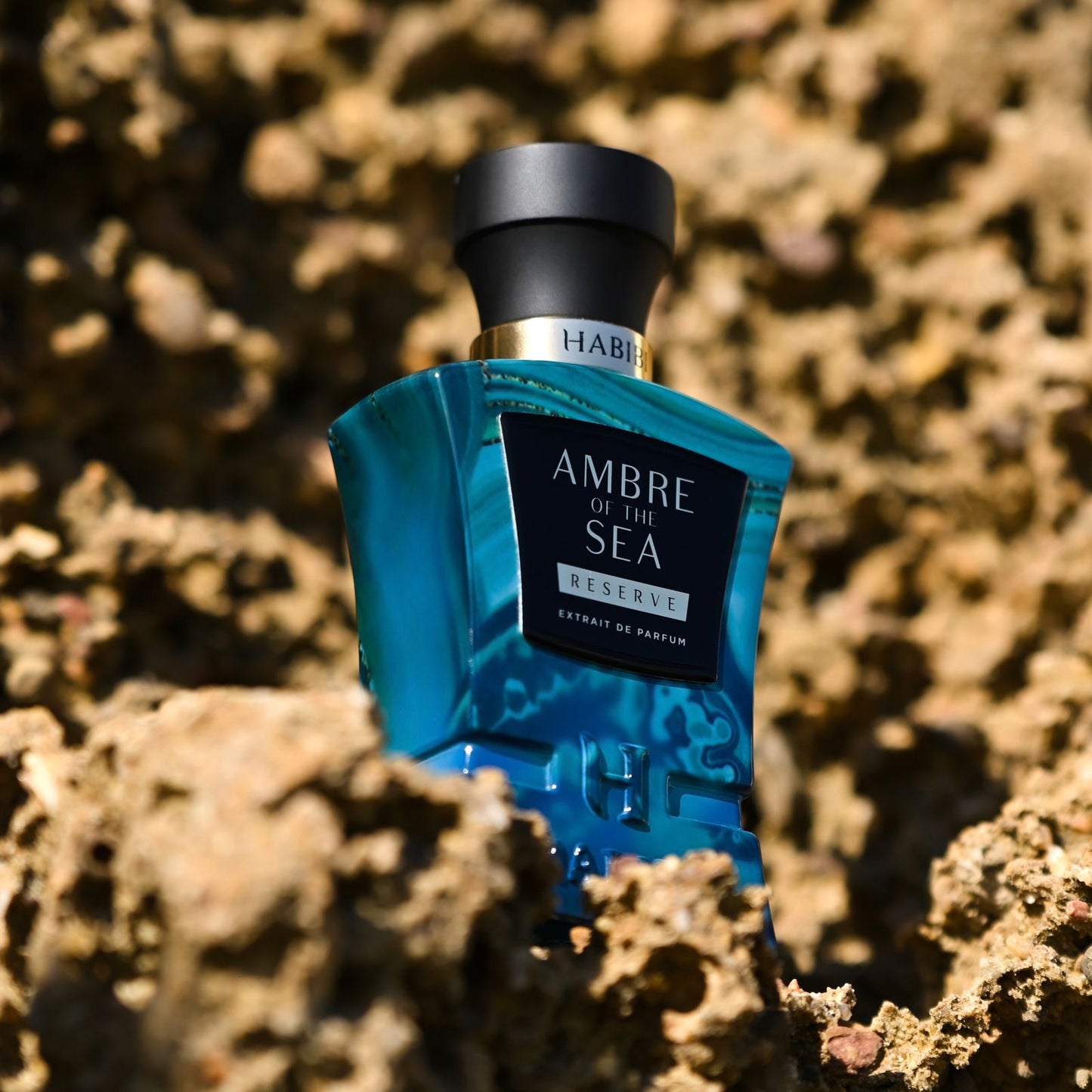 Ambre of the Sea fragrance in an elegant blue bottle by Habibi New York.