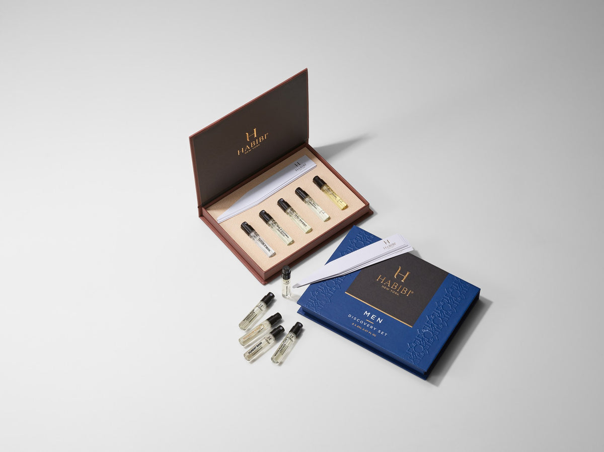 Men's and Oud Discovery Sets together, open boxes with ten 2 mL vials